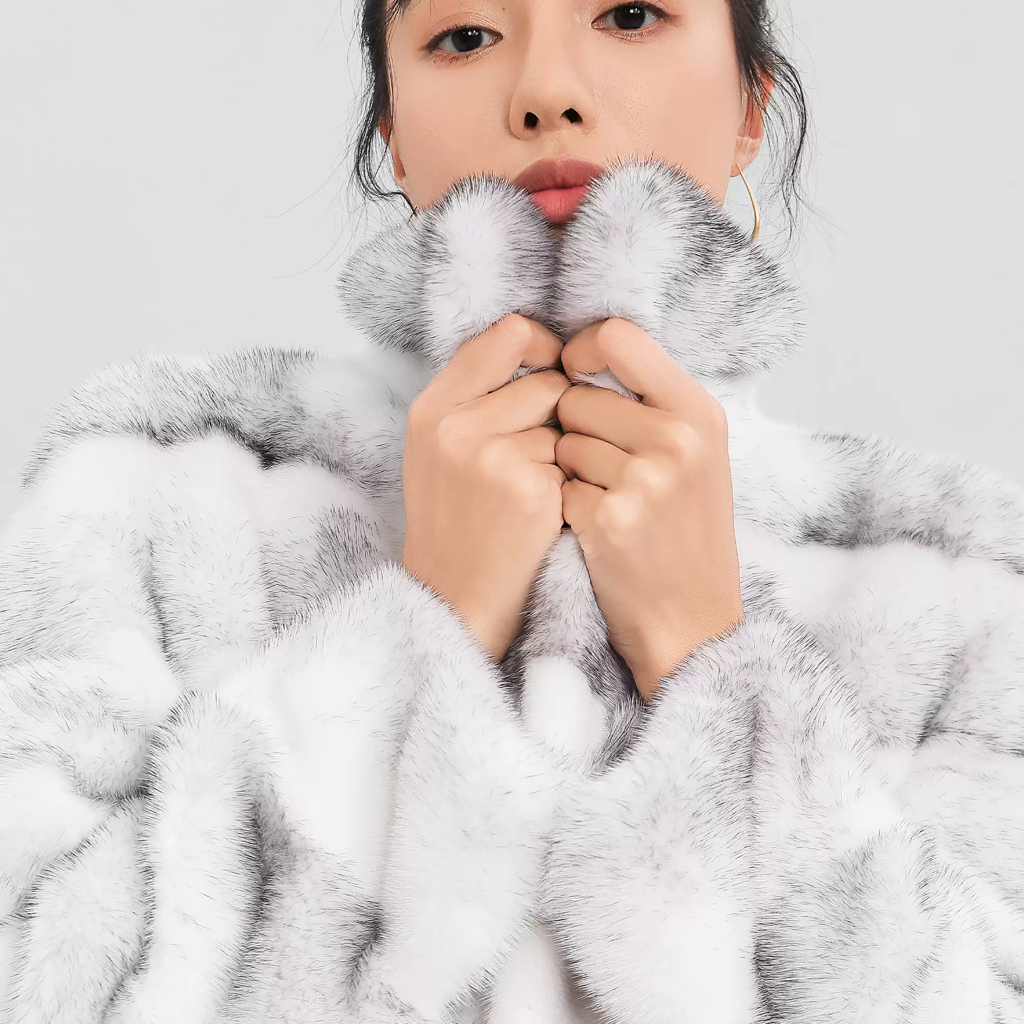 Women's elegant, minimalist, and versatile short-length natural-color Cross Mink fur coat with a lapel collar